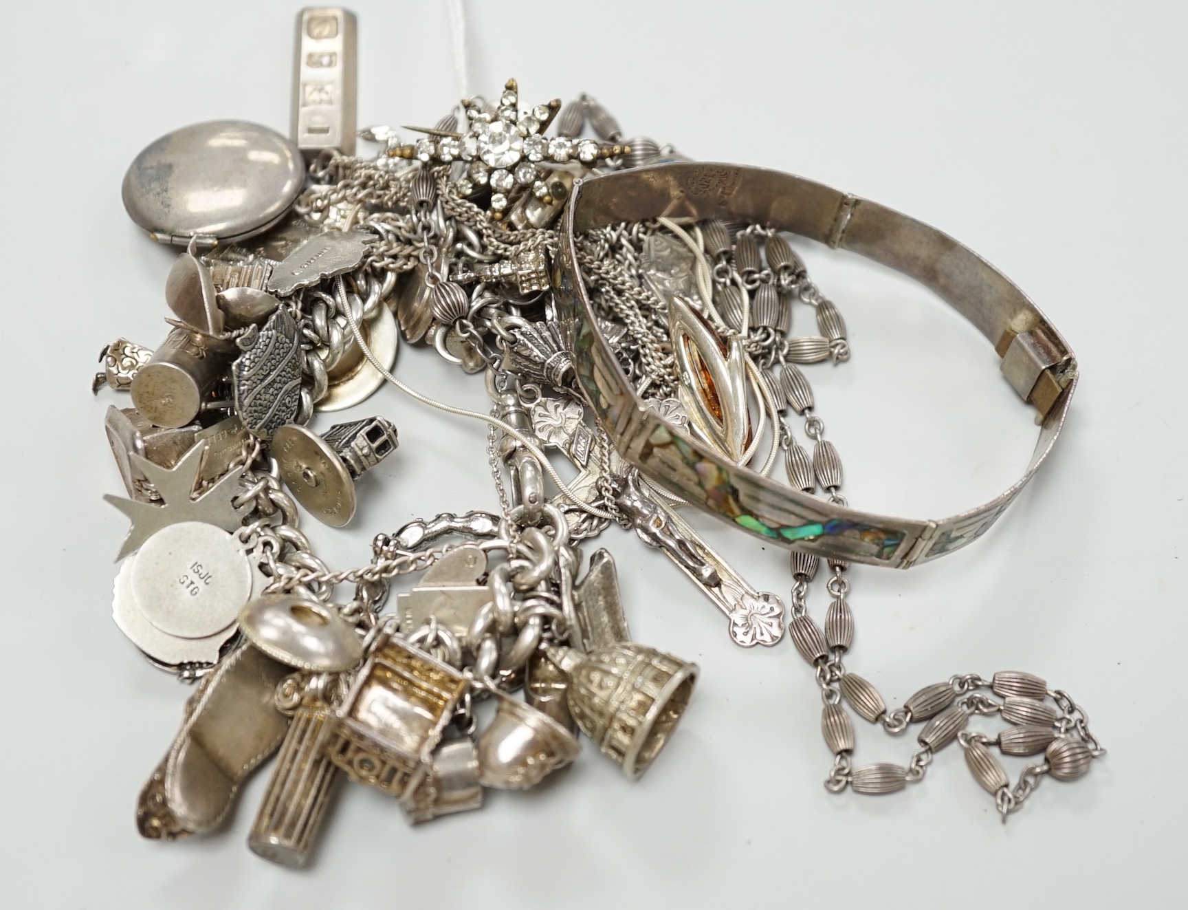 A silver charm bracelet and a small quantity of other silver and white metal jewellery.